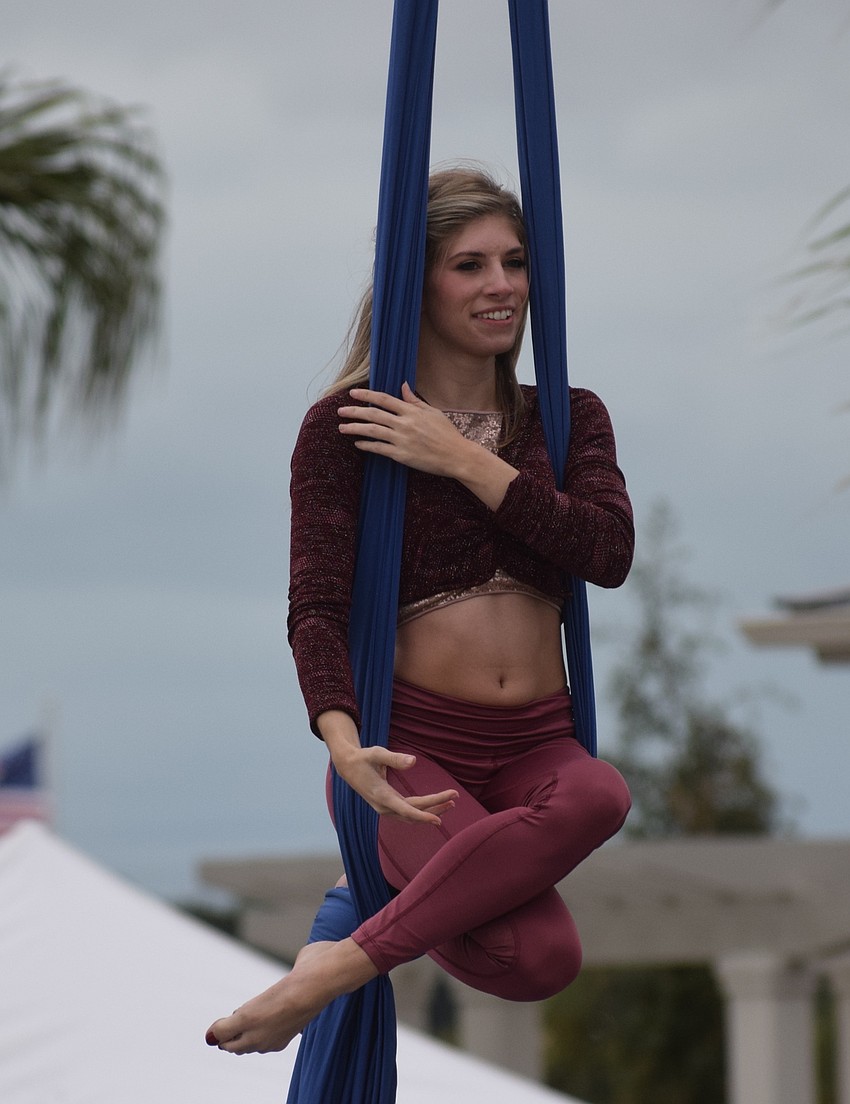 Caitlyn Haley, the owner of Star Academy of Dance and Aerial Arts puts on an aerial exhibition after the 5K was complete.