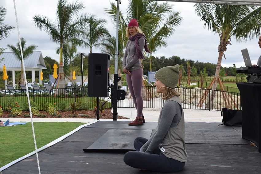Boston's Trish Hart and Yoga Shack owner Courtney Smith led the meditation and yoga portions of the event.