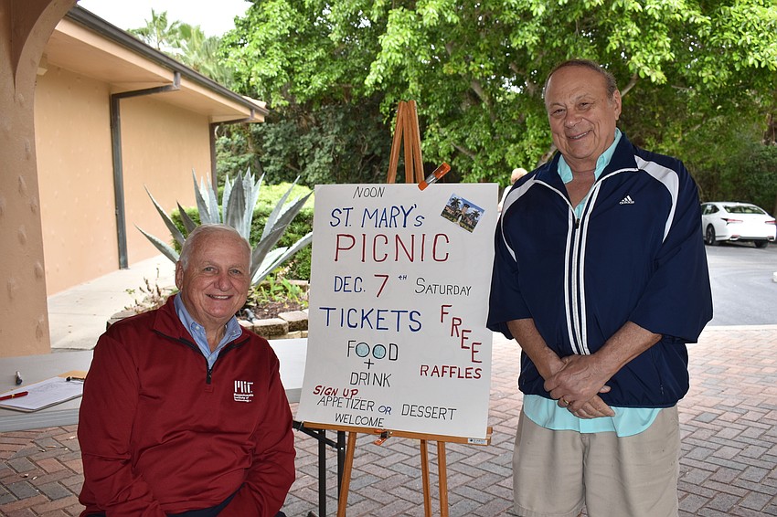 Mike Chichon and Chuck DiNatale advertise the church's next event.