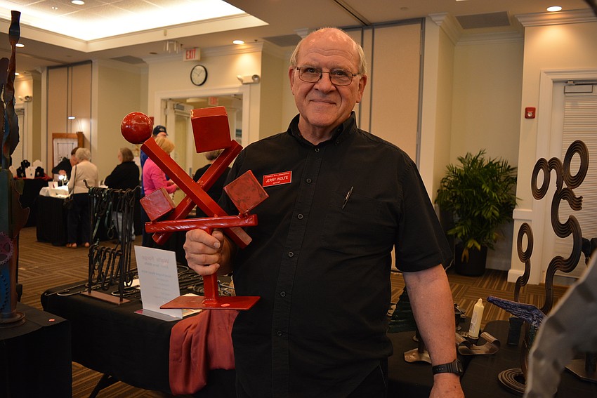 Artist Jerry Wolfe specializes in metal art. He makes sculptures, hooks, hangers and candle holders.