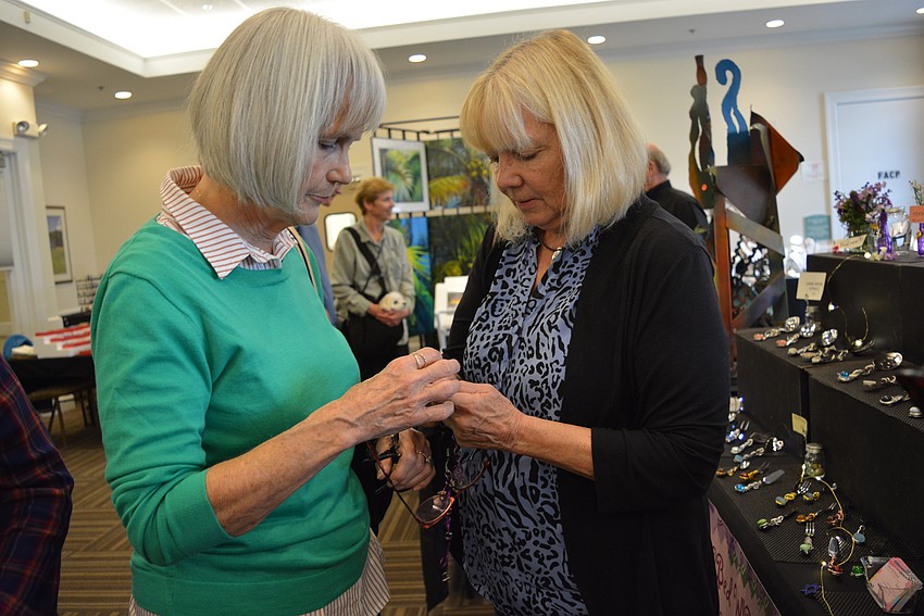 Lakewood Ranch's Maggie Magee helps her friend, Corrine Wagner, with an eyeglass chain. Wagner decides to purchase it.