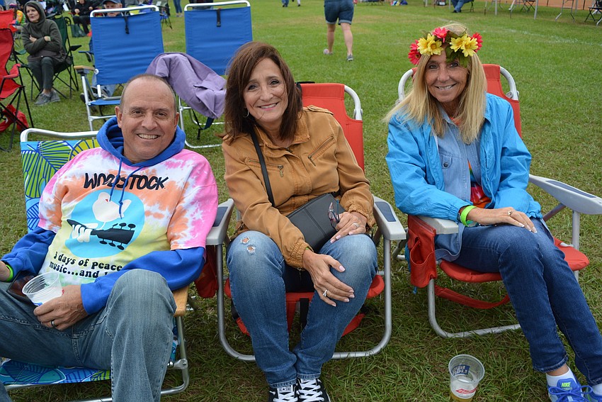 Lakewood Ranch's Gary and Annette Pollack attend Giving Hunger the Blues with Helen Laroche. They liked the Woodstock-themed music that was presented.