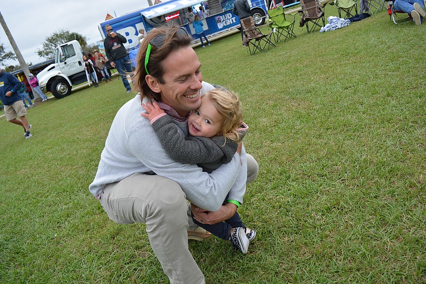 Sarasota's Evan Barniskis steals a hug from his 18-month-old daughter, Eve, who enjoyed dancing. 