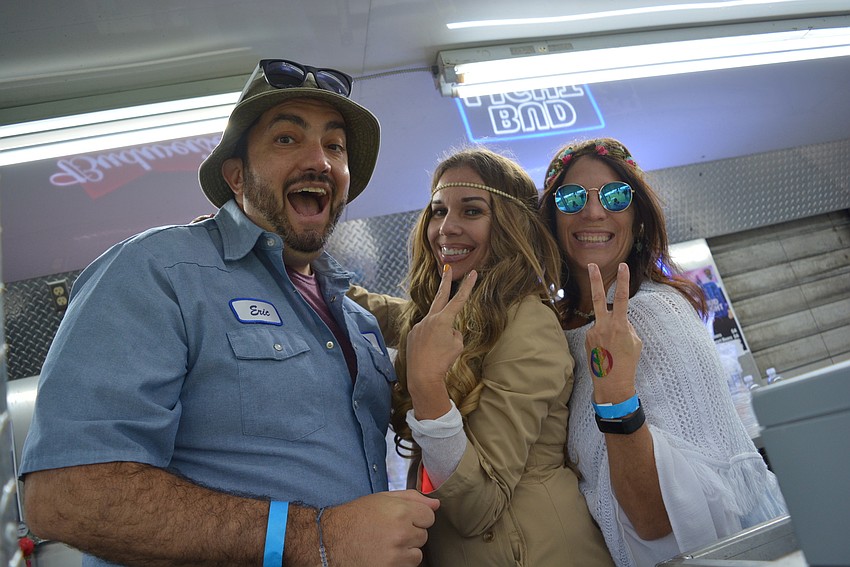 Steve Delp, Dina Breneman and Josie Reside volunteered to serve beer to guests for the third year in a row.