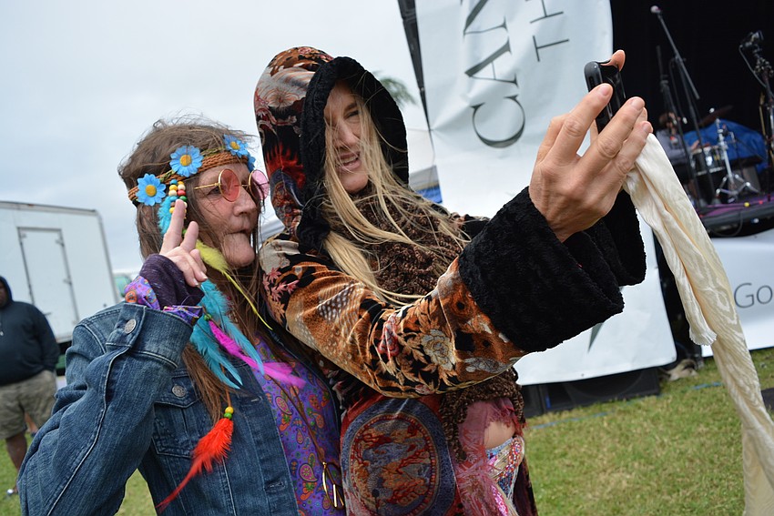 Fan Darlne Warren gets a selfie with Twinkle Yokim before Yokim heads on stage. She is lead singer for Twinkle & Rock Soul Radio.