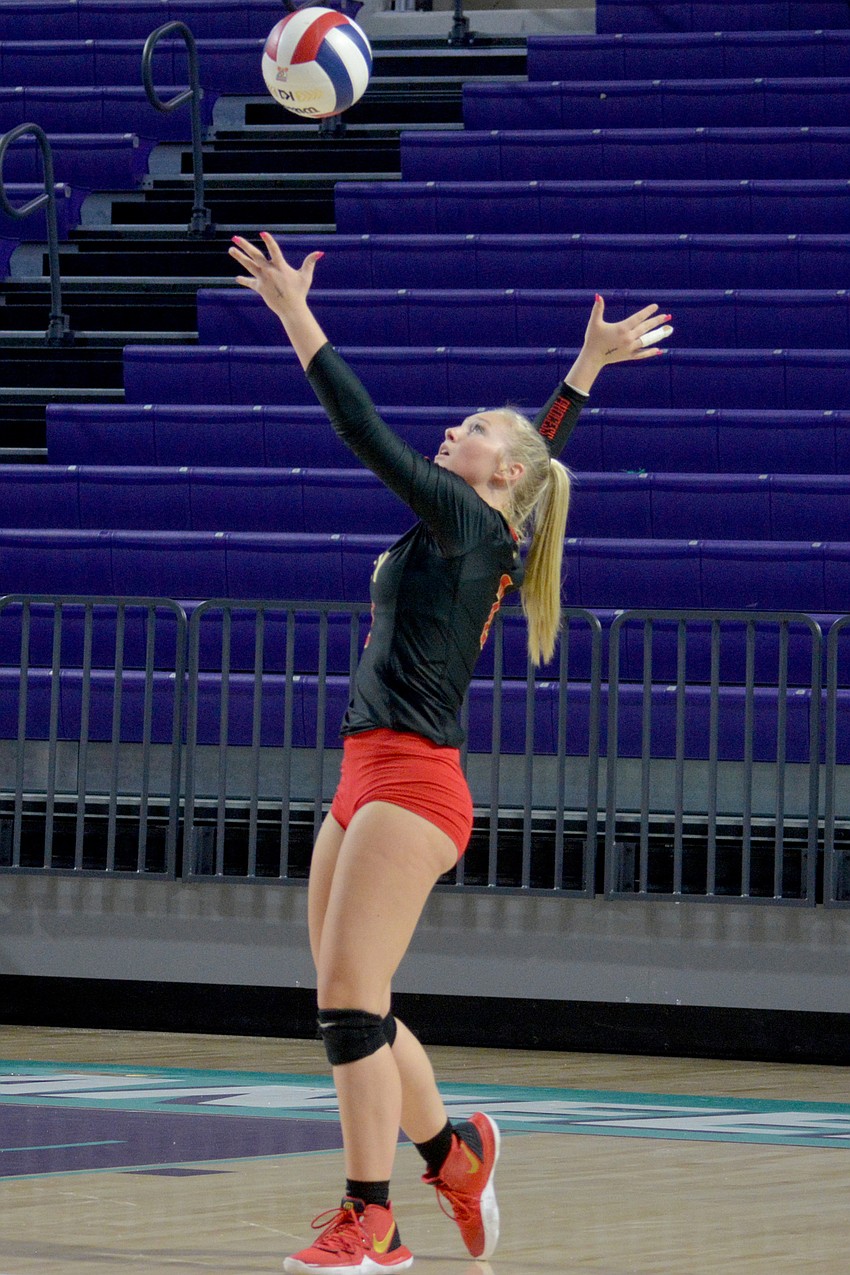 Madison Brown serves for Cardinal Mooney. She finished with 15 digs and an ace.