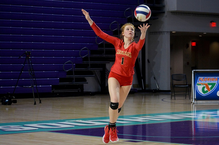 Izabella Rae serves for the Cougars. She finished with a game-high 46 assists.