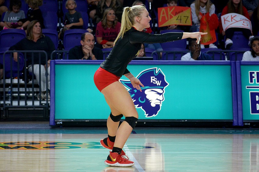 Madison Brown points out a Westminster strategy to her teammates.