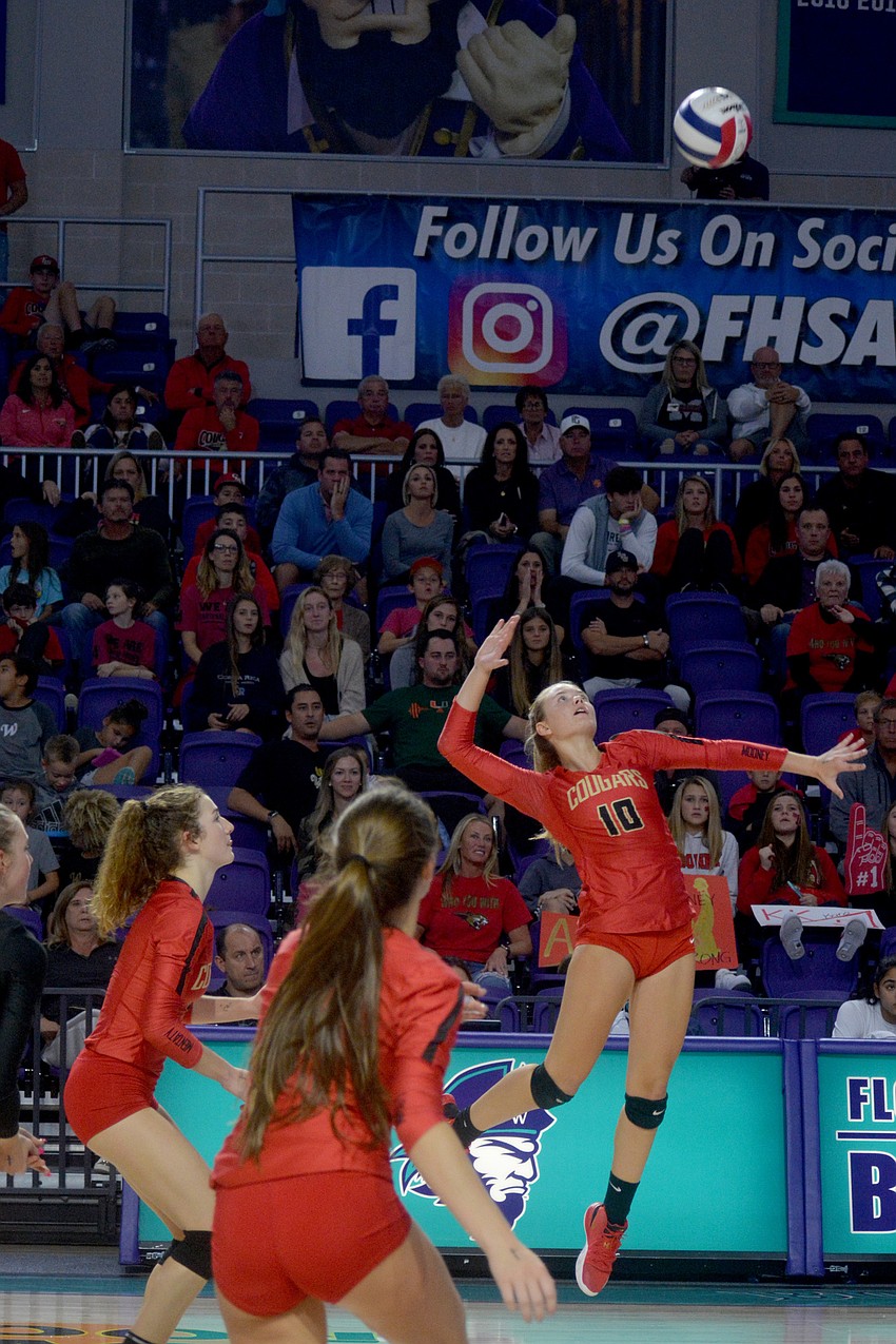 Mary Page soars for a crushing shot.