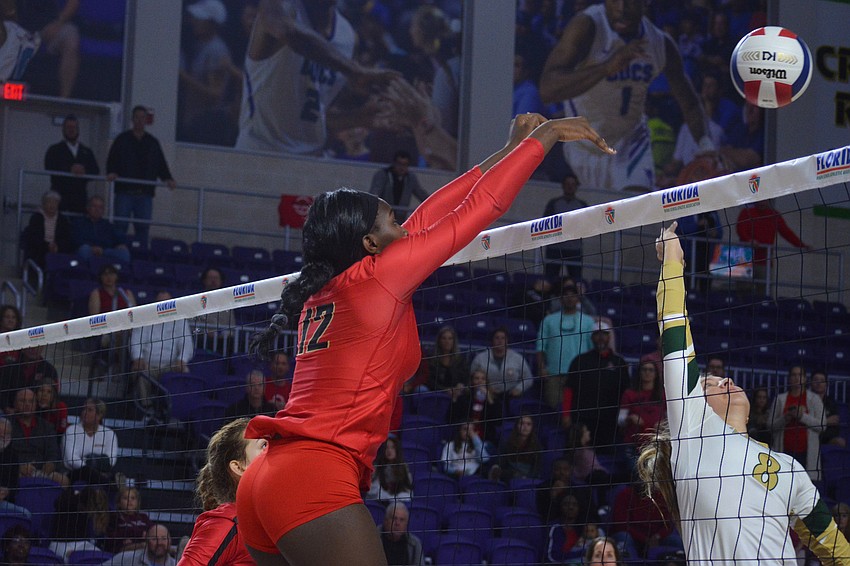 Jordyn Byrd turns back a Westminster kill attempt. She finished with eight kills and four blocks.