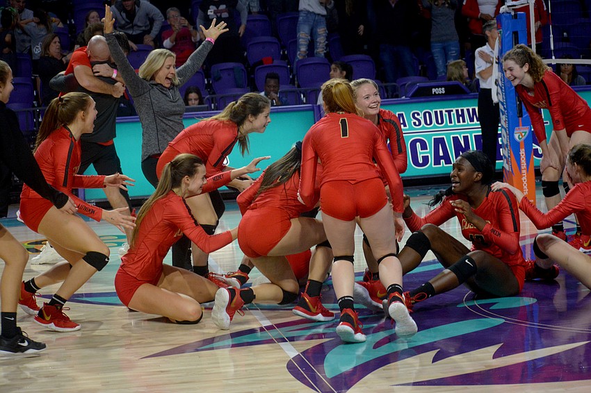 The Cougars come together after securing the state title against Westminster Christian.