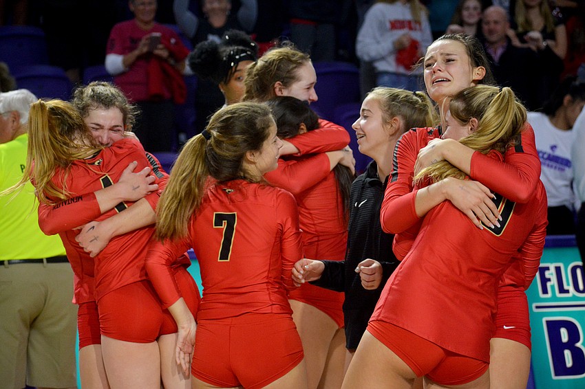 The Cougars embrace each other after winning the state title.