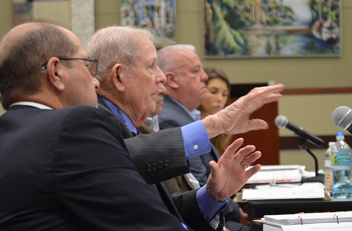 Town labor negotiator Reynolds Allen, second from left, makes  a point to the Town Commission. Town Manager Tom Harmer, union president Mick McHale and union attorney Caroleen Brej listen.