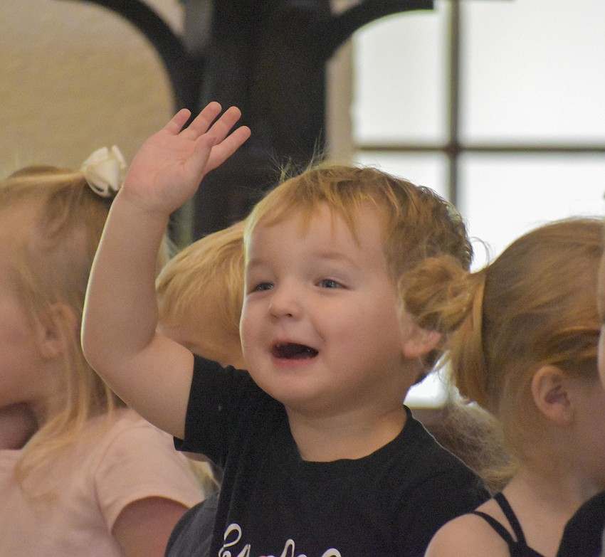 Carter Stine calls out hello to his mom in the audience.