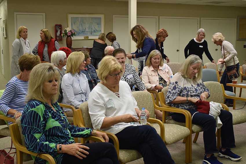 Members found their seats just before the speakers began.