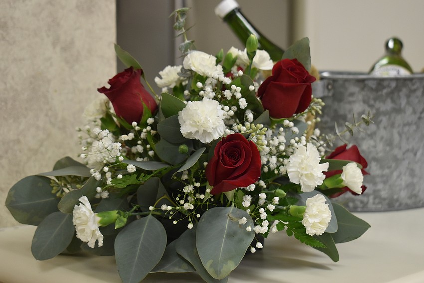 One of the flower arrangements to be won included roses.