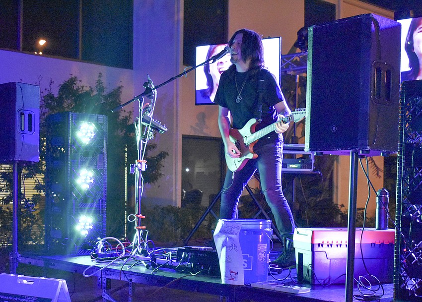 Gary Schutt plays '80s hits to the crowd.