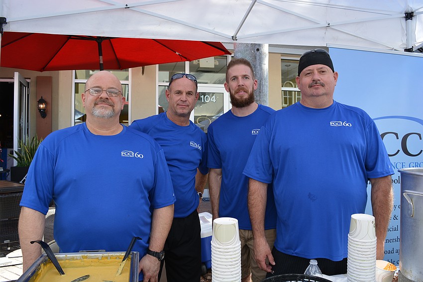 FCCI Insurance's Blake Perkins, John Kretkowski, Andrew Hoffa and Scott Langdon serve up Perkins' special butternut squash bisque. It's made with butternut squash, chicken stock, thyme, brown sugar and nutmeg.