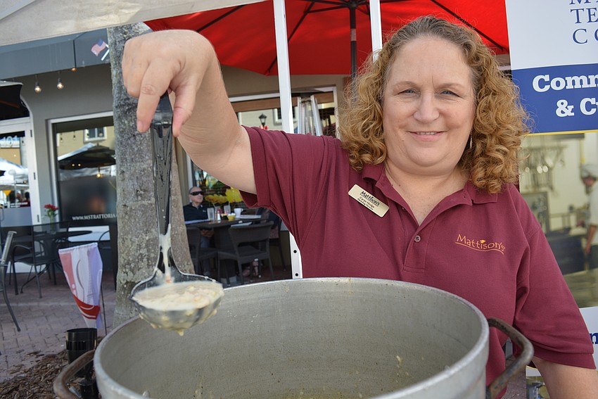 Mattison's Restaurants and Catering Marketing Director Caryn Hodge serves Mattison's New England clam chowder.