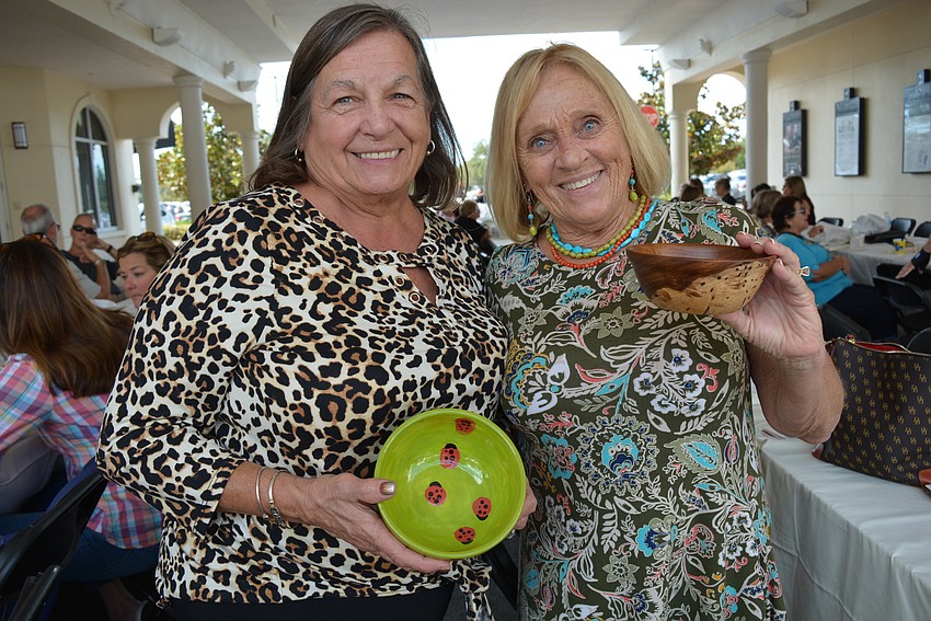 Parrish residents Sandra Pigaga and Debbie Espinola show off their unique bowls.
