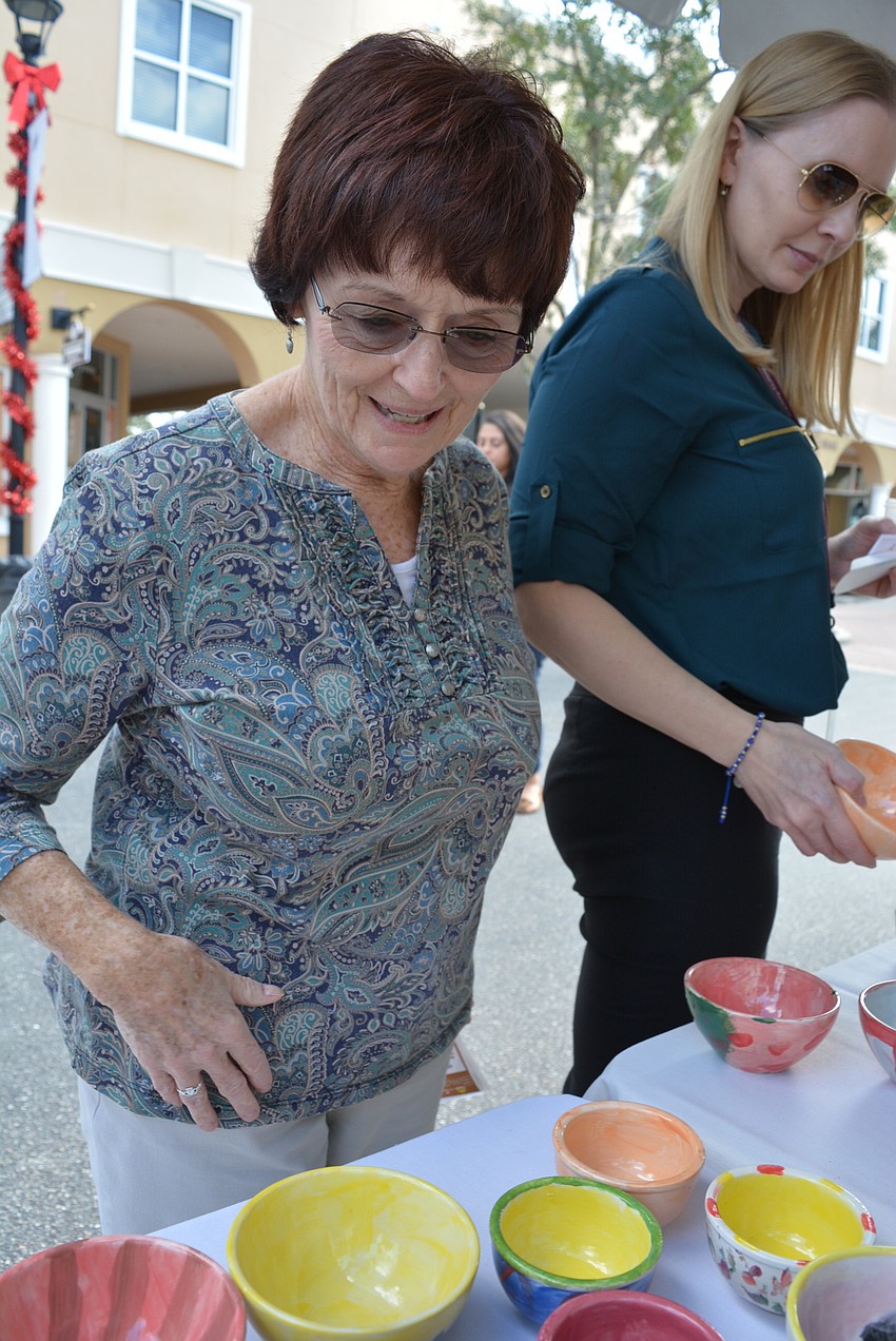 Schroeder-Manatee Ranch's Kathy Horn hunts for the perfect bowl. Last year, she found one with flamingos, which matched her bathroom.