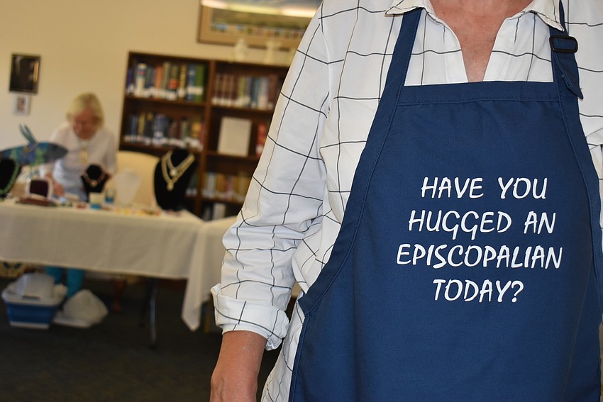 Gail Clay (shown via her apron), organized the event for the church.