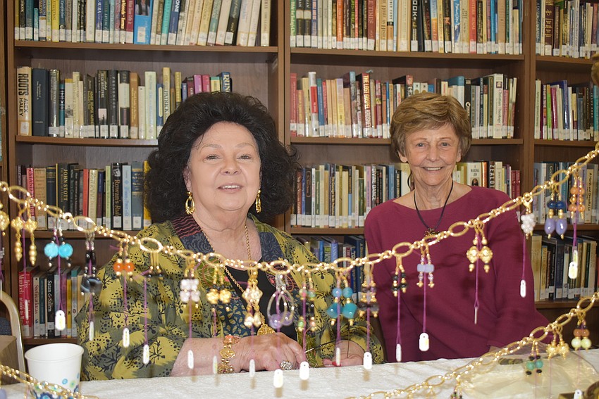 Virginia Spitler and Beverly Henry behind the earrings they were selling.