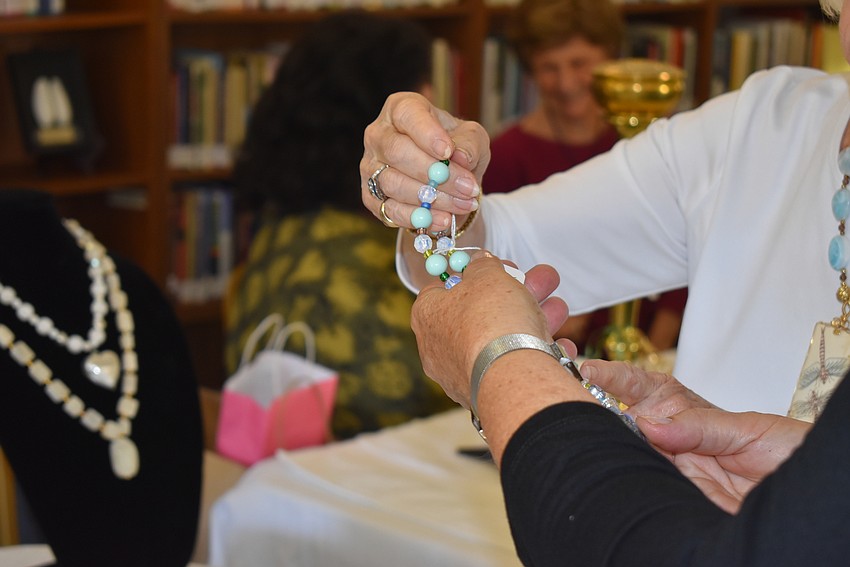 Pam Toft and Daphne Walker take a closer look at a necklace.