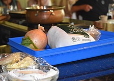 A thawed duck and the ingredients for a mirepoix wait for Chef Arpke.