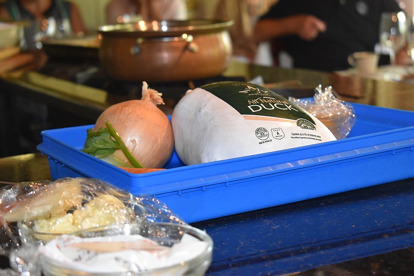 A thawed duck and the ingredients for a mirepoix wait for Chef Arpke.