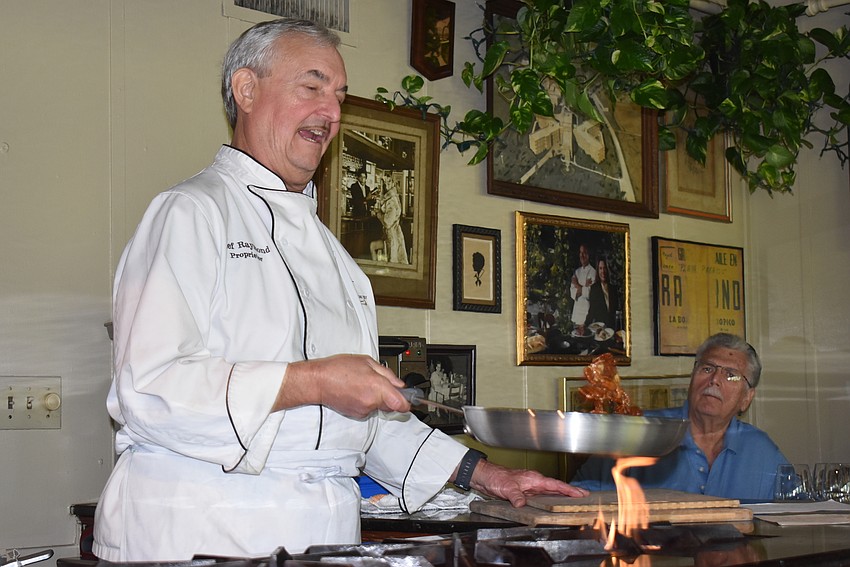 Arpke flips pecans while candying them.