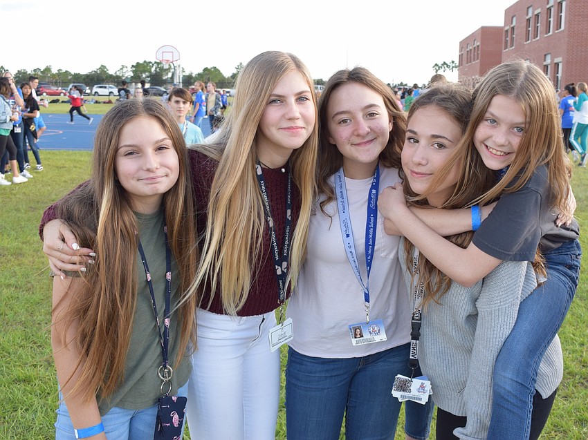 London Mcmichael, Taylor Krame, Grayce Bittenbender, Lacey Salvatori and Claire Femenia, all seventh-graders, enjoy the walk-a-thon on their last day of school before Thanksgiving break.