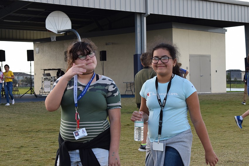 Montana Romine and Sofia Ortega, sixth-graders, walk together. Ortega liked being out of class to participate in the event.