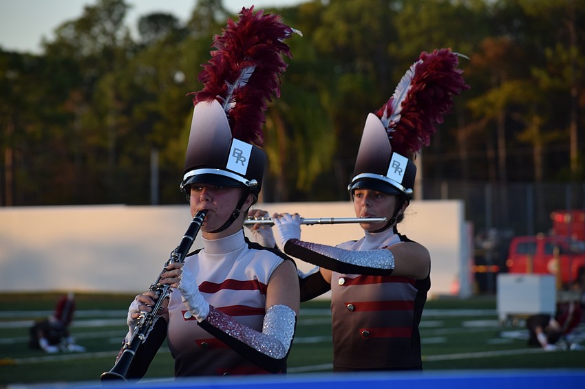 Braden River sophomore Sheri Benson and freshman Makayla Clary move around the field while playing.
