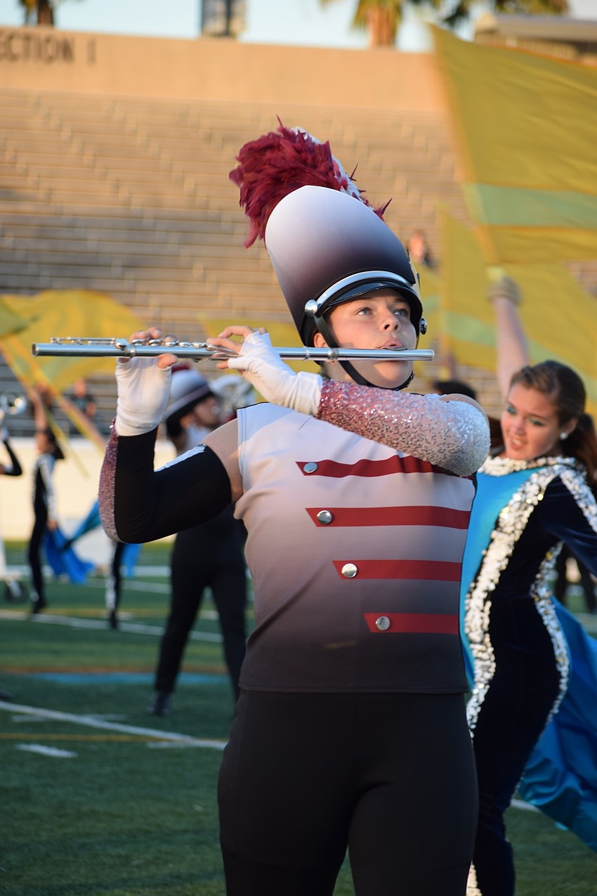 Braden River freshman Allison Sicard marches and plays along her fellow Marching Band of Pirates members.