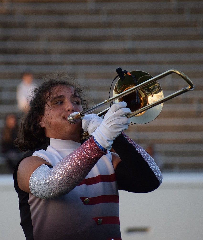 Braden River's Jonah Jacobbi and other trombone players join Braden Hameed, who just finished a solo.