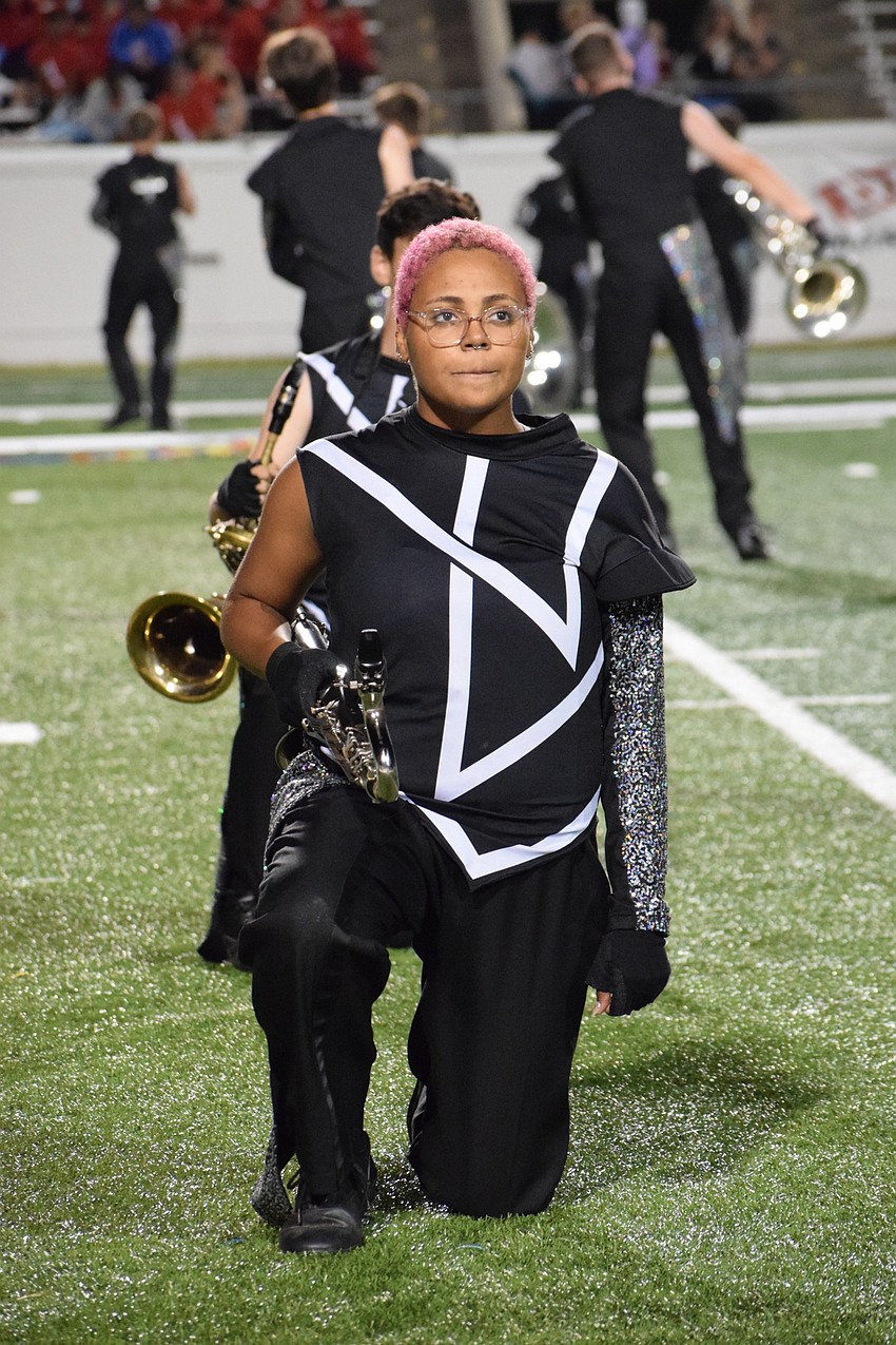 Lakewood Ranch senior Gabi Zimmerman kneels as part of the show formations.