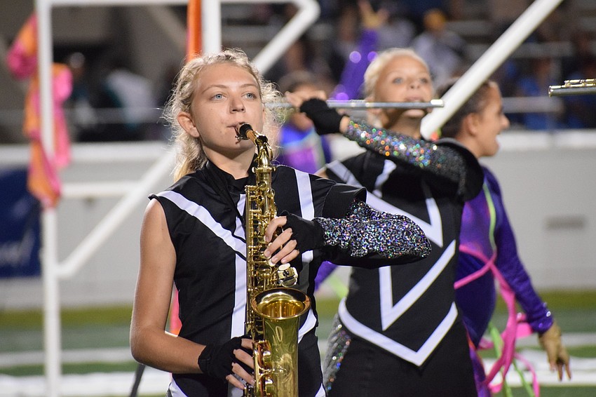 Lakewood Ranch freshman Lucia DeVictor keeps her eyes on the conductors while marching and playing.