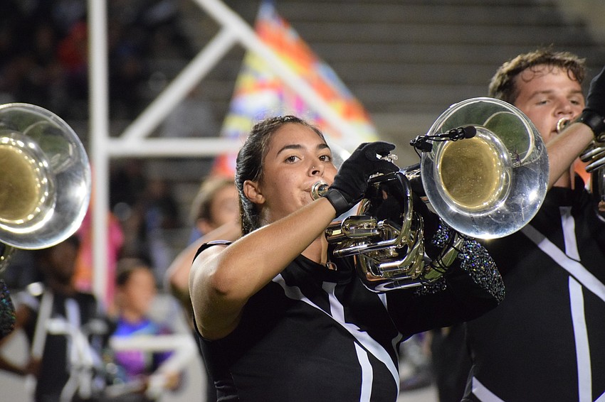 Lakewood Ranch junior Gianna Hagopian performs with a microphone to project her sound in the stadium.