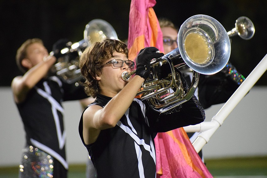 Lakewood Ranch freshman Ty Dauphas follows other marches are they move forward on the field.