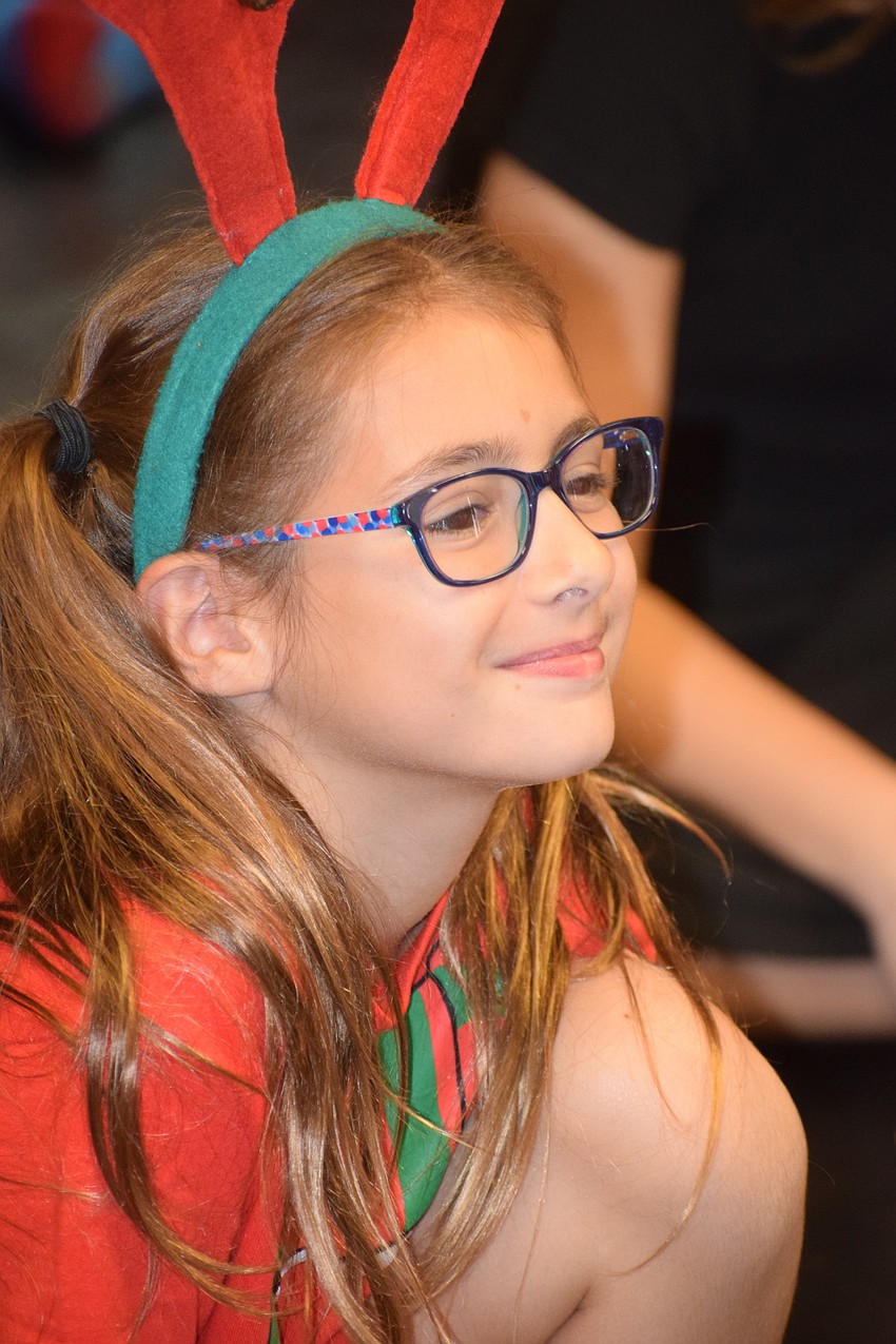 Lara Zoppe listens to instructions during a rehearsal for The 12 Dolls of Christmas.