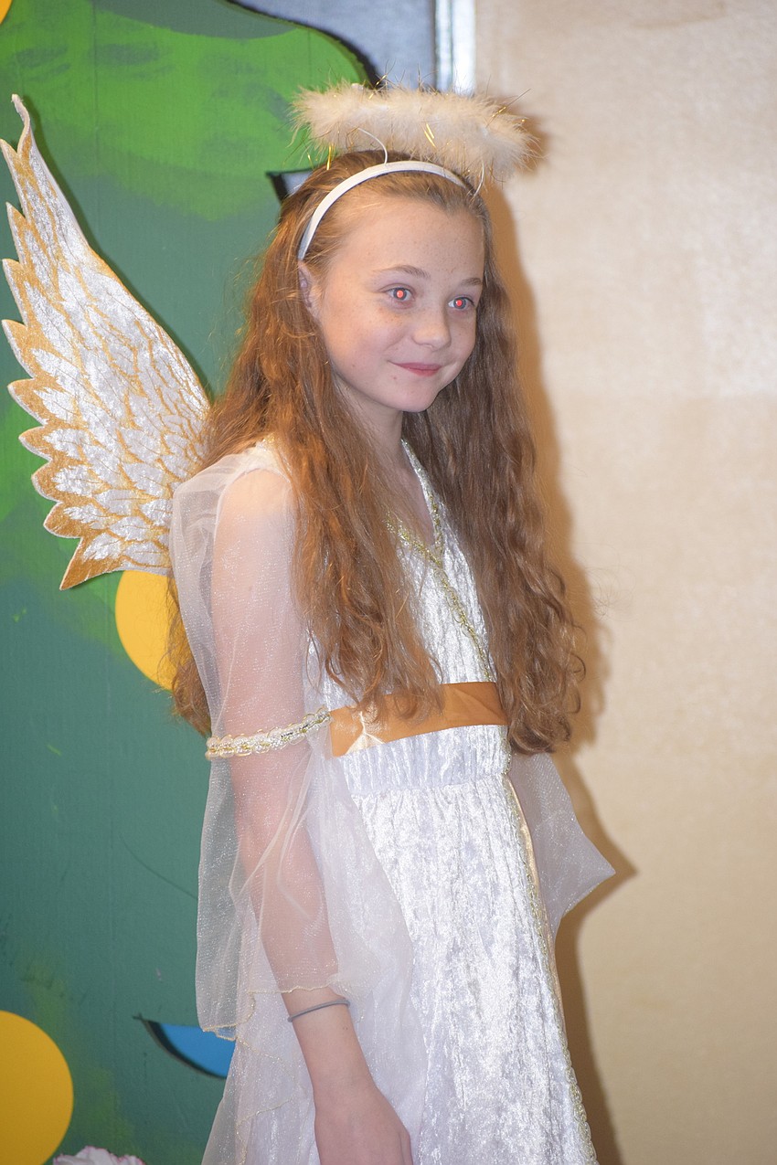 Alexia Mattes gives her performance as an angel Christmas Ornament.