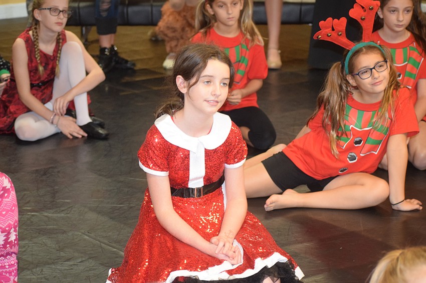 Mia DuJardin listens to the direction of Ovation owner Michelle McCord.