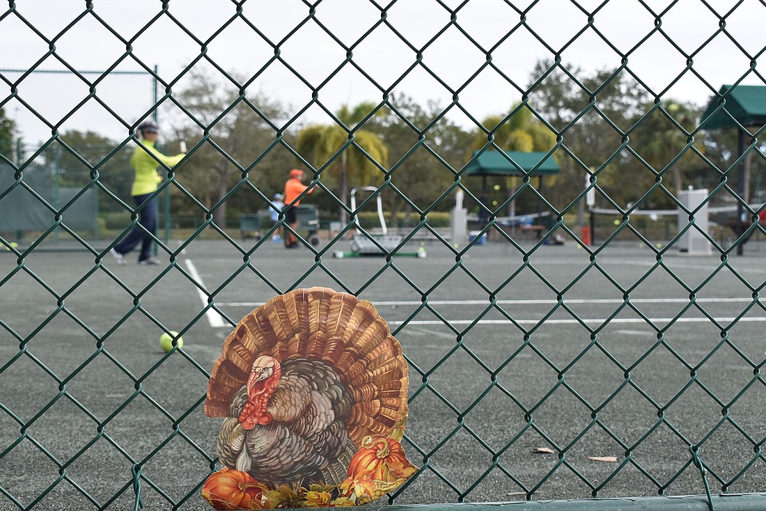 Kay Thayer returns a serve at the Longboat Key Tennis Center, where you can get a "serving" of a different kind on Thanksgiving Day.