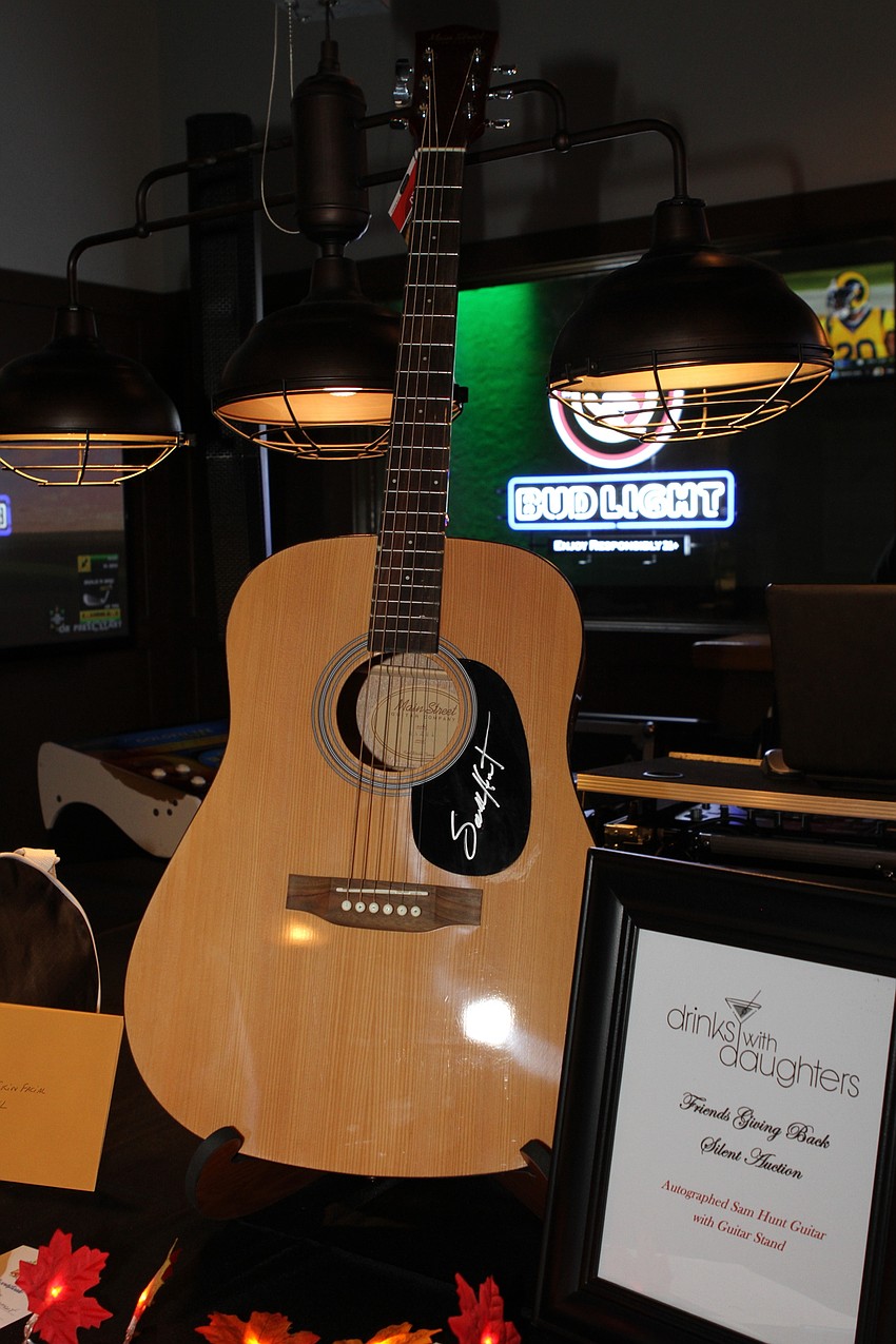 The night's raffle included a signed guitar and other prizes.