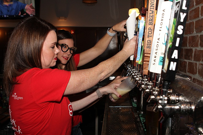 Tiffany Thornhill and Jennifer Matteo poured drinks.