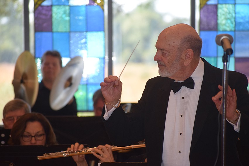 Joe Miller founded the Lakewood Ranch Wind Ensemble and he conducts the group during its first concert at Our Lady of the Angels Catholic Church.