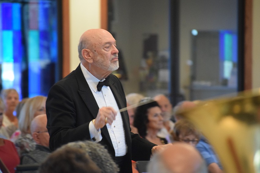 Joe Miller founded the Lakewood Ranch Wind Ensemble and he conducts the group during its first concert at Our Lady of the Angels Catholic Church.
