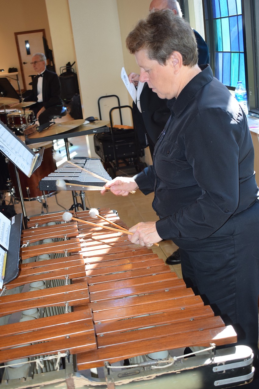 North Port's Lynn Cleary plays the marimba.