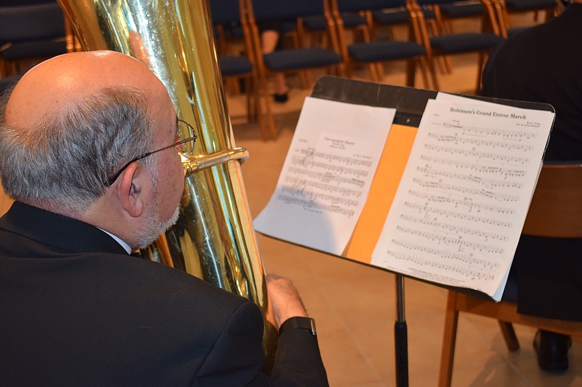 Sarasota's Jim Damoulakis and his fellow Lakewood Ranch Wind Ensemble members had few rehearsals before the event, but they were met with stirring ovations.